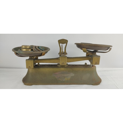 389 - A set of vintage shop scales with assortment of weights.