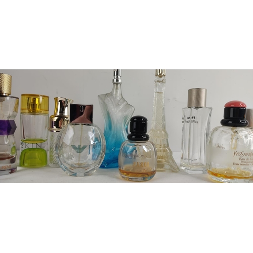 390 - A large collection of perfume bottles.