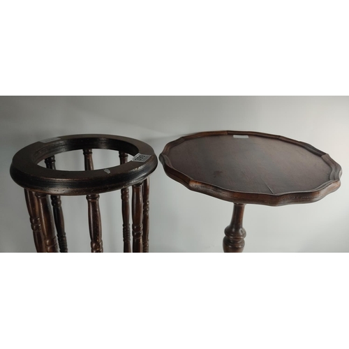 399 - A vintage wine table on tripod base & umbrella stand.