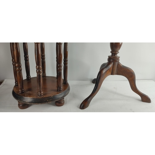 399 - A vintage wine table on tripod base & umbrella stand.