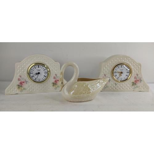 404 - 2 ceramic cased clocks & a Belleek Pottery 'Swan' milk jug.