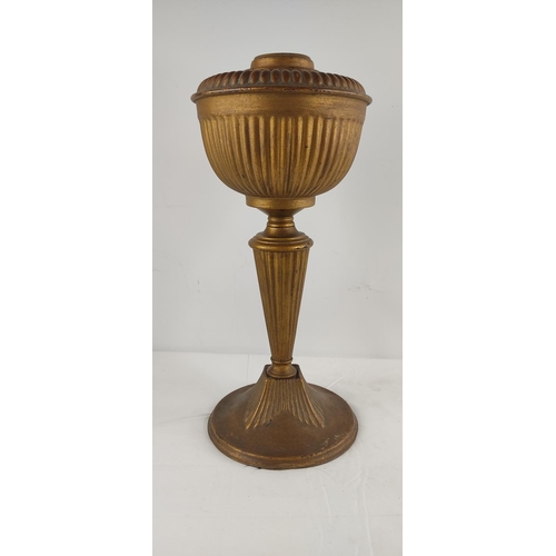 408 - An antique decorative metal oil lamp base.