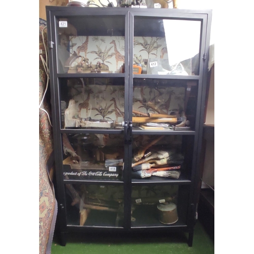 421 - A metal bookcase with glass doors.