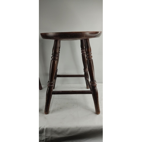 461 - A pair of vintage wooden pub stools.