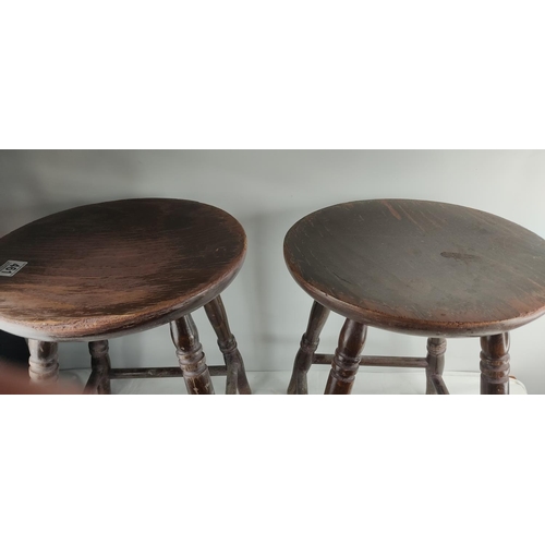 461 - A pair of vintage wooden pub stools.