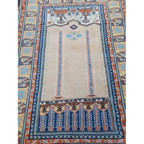 422 - A large decorative rug measuring 64