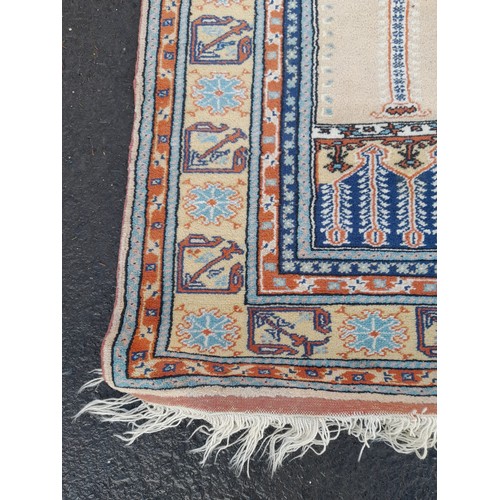 422 - A large decorative rug measuring 64