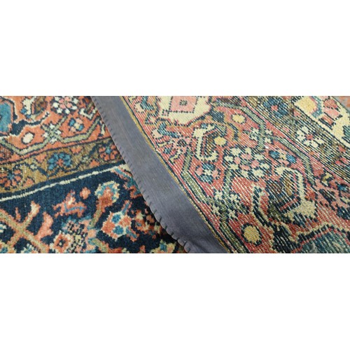 423 - A large decorative rug, measuring 85