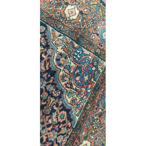 423 - A large decorative rug, measuring 85