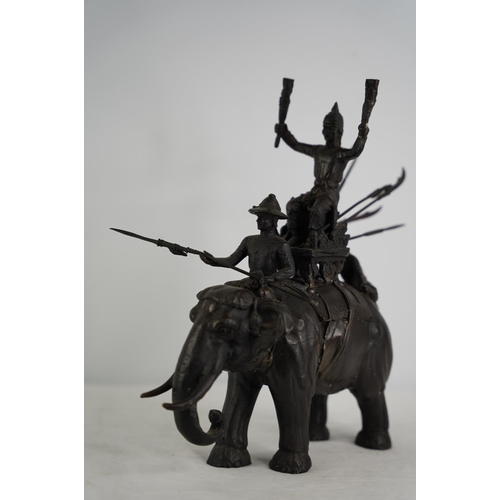 108 - A stunning Oriental bronze elephant & riders figure.