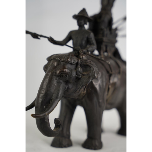 108 - A stunning Oriental bronze elephant & riders figure.