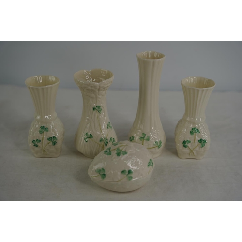 119 - Four Belleek pottery vases and a lidded egg shaped trinket holder.