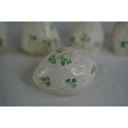 119 - Four Belleek pottery vases and a lidded egg shaped trinket holder.