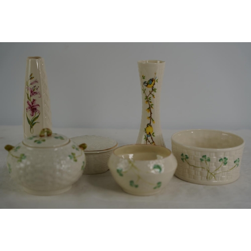 125 - Five pieces of Belleek pottery and another Donegal pottery vase.