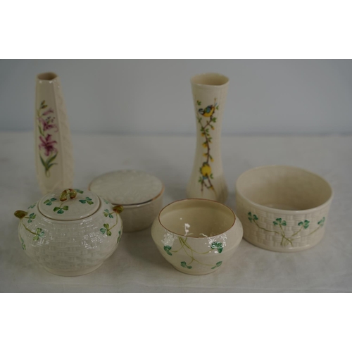 125 - Five pieces of Belleek pottery and another Donegal pottery vase.