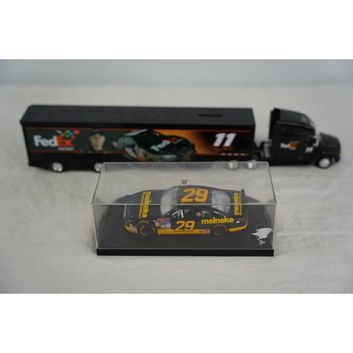 21 - A cased Quartzo racing car and a 'Fedex Racing' lorry.