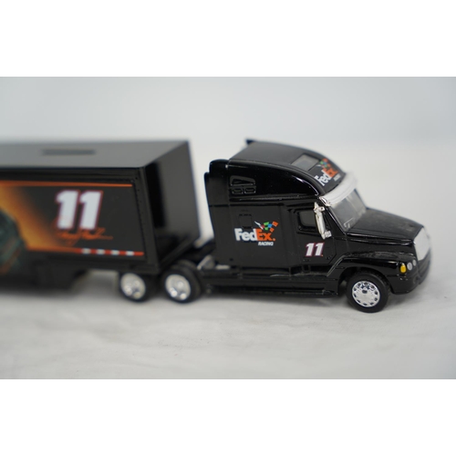 21 - A cased Quartzo racing car and a 'Fedex Racing' lorry.