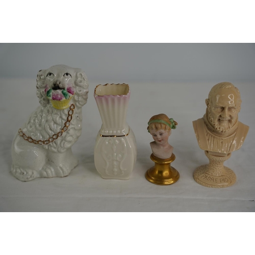 24 - A miniature Padre Pio resin bust, a Capidomonte bust of a girl, an antique Staffordshire dog and a B... 