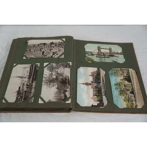 26 - An antique postcard album.