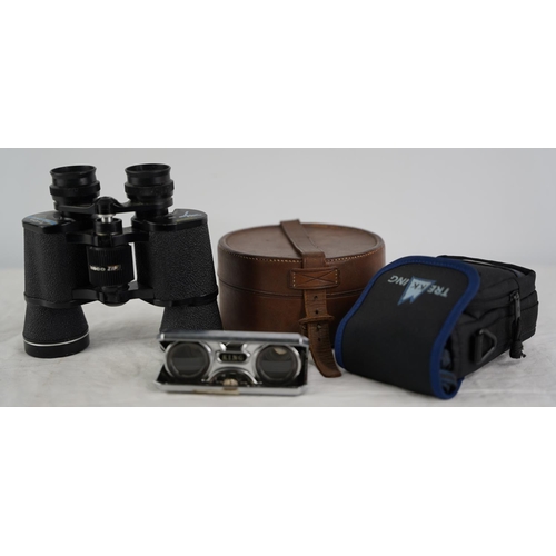 31 - A Tasco 8 x 40mm field glasses, an Olympus camera and more.