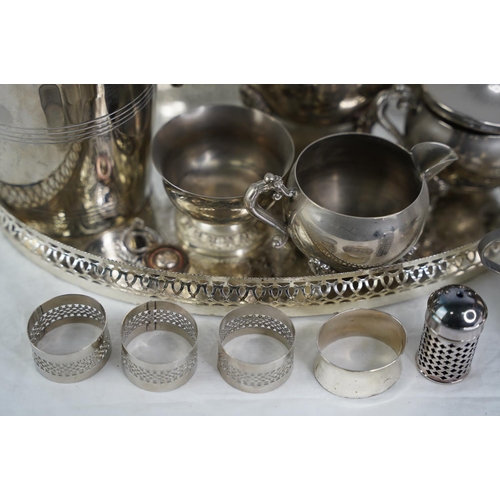 32 - An EPNS tea service and tray, a silver plated ice bucket and more.