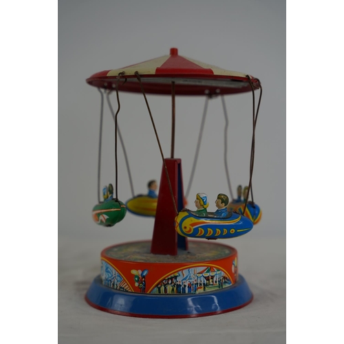 33 - A German tin plate fairground toy.