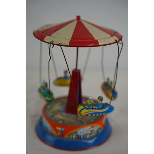 33 - A German tin plate fairground toy.