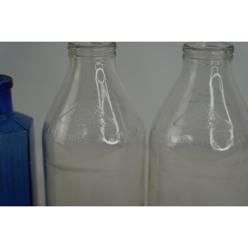 35 - Two vintage glass milk bottles, a P Murphy mineral water bottle and more.