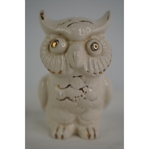 42 - An antique ceramic owl money box.