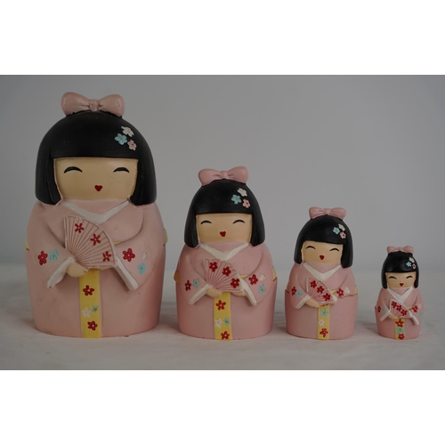 43 - A set of Japanese style ceramic Babushka dolls.