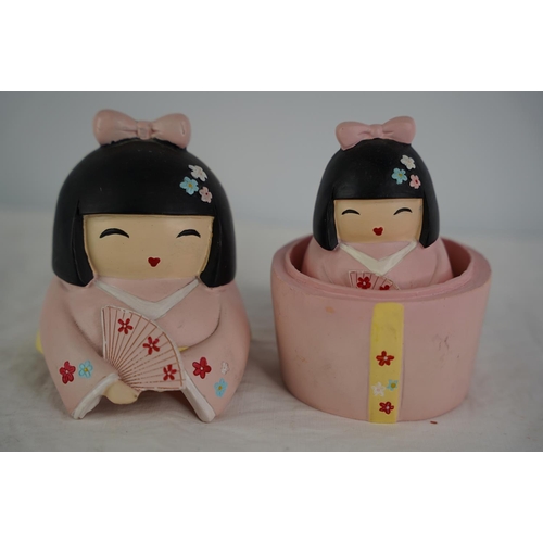 43 - A set of Japanese style ceramic Babushka dolls.