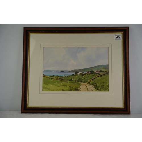 45 - A framed watercolour 'Whitepark Bay from Dunservick', signed David McCracken.45x55