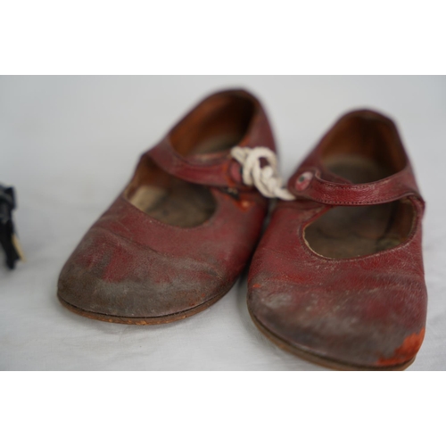 48 - A pair of vintage child's leather shoes and two ornamental elephants.