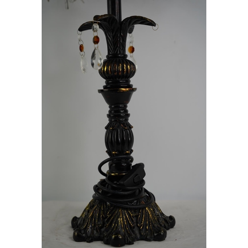 59 - A large metal and gilt table lamp and shade.