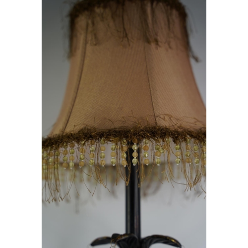 59 - A large metal and gilt table lamp and shade.