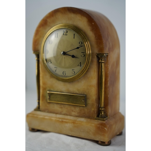 60 - An antique French marble and brass mantle clock with presentation plaque.