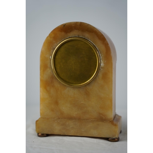 60 - An antique French marble and brass mantle clock with presentation plaque.