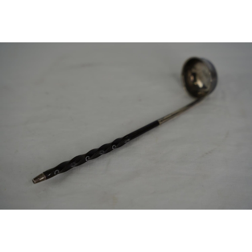 75 - A Georgian Silver toddy ladle with whalebone handle.