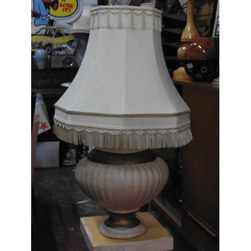 128 - A ceramic table lamp and matching pedestal base.