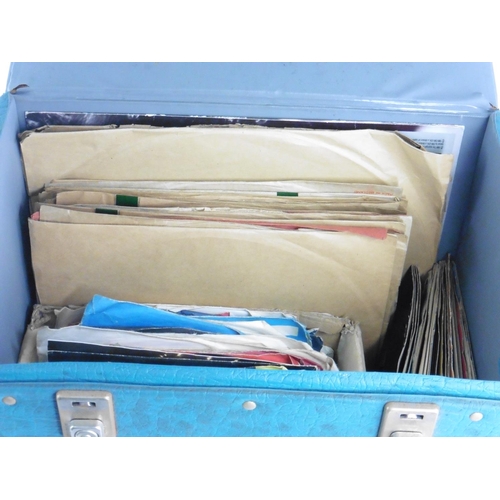 141 - A vintage case of 45's and LPs.