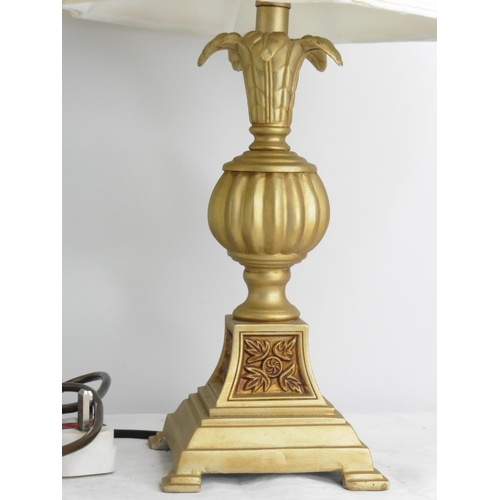 144 - A heavy brass table lamp and shade and another.