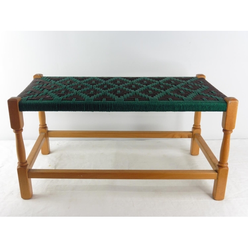 153 - A long vintage rattan topped stool.