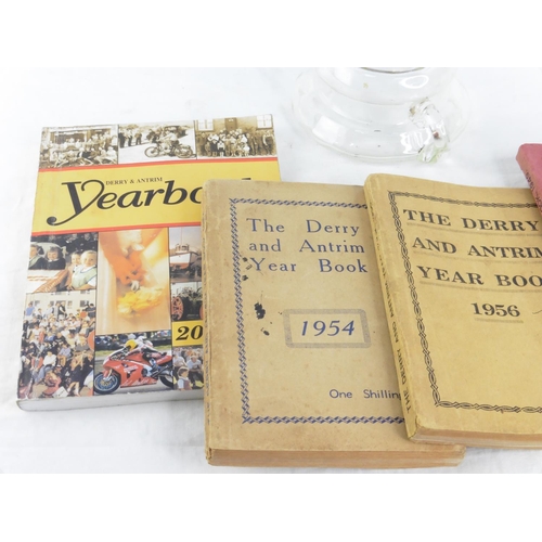 162 - Four Derry & Antrim Year Books - 1949, 1954, 1956 and another and a clear glass finger lamp.