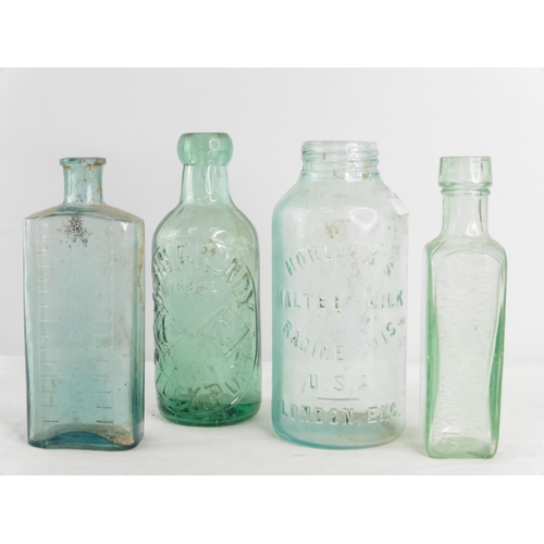 163 - A vintage Horlick's glass bottle and three others.