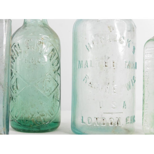 163 - A vintage Horlick's glass bottle and three others.