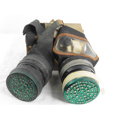 169 - Two vintage gas masks.