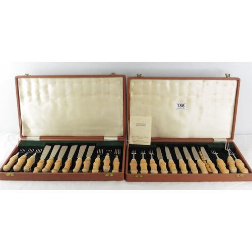 186 - Two vintage cased sets of Mills Moore stainless steel cutlery with walnut wood handles.