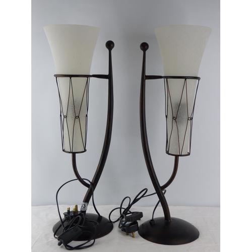 203 - A pair of large modern table lamps with glass shades.