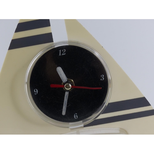 211 - A vintage table top desk clock with water and rocking feature.