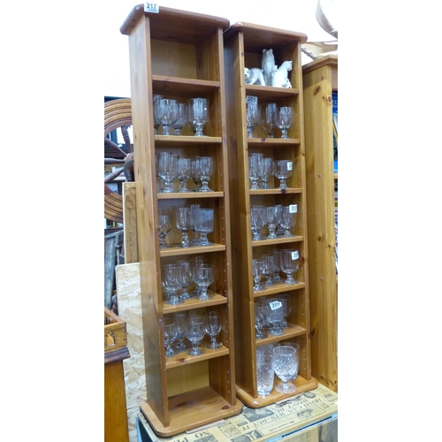 217 - A pair of pine slimline bookcases.